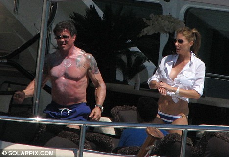 Stallone can be seen below, complete with tattoos, enjoying a spot of 